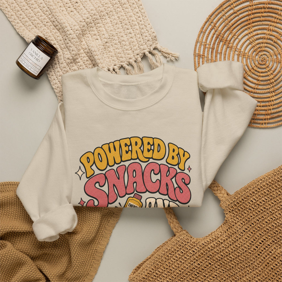 Powered by Snacks and Spite Sweatshirt - Sand - flat lay