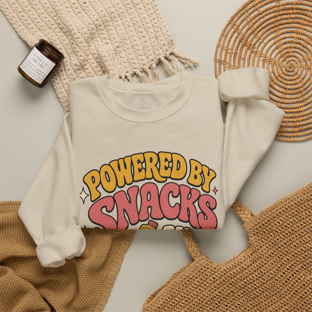 Powered by Snacks and Spite Sweatshirt - Sand - Flat Lay